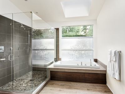 Walk-in shower with natural stone accents
